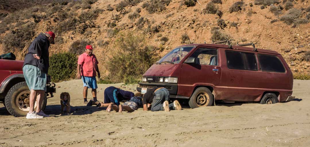 van stuck in sand