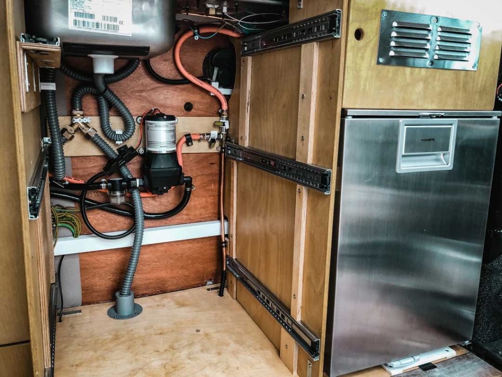 https://kombilife.com/wp-content/uploads/2019/11/Simple-Van-Life-Grey-Water-System-1024x768.jpg